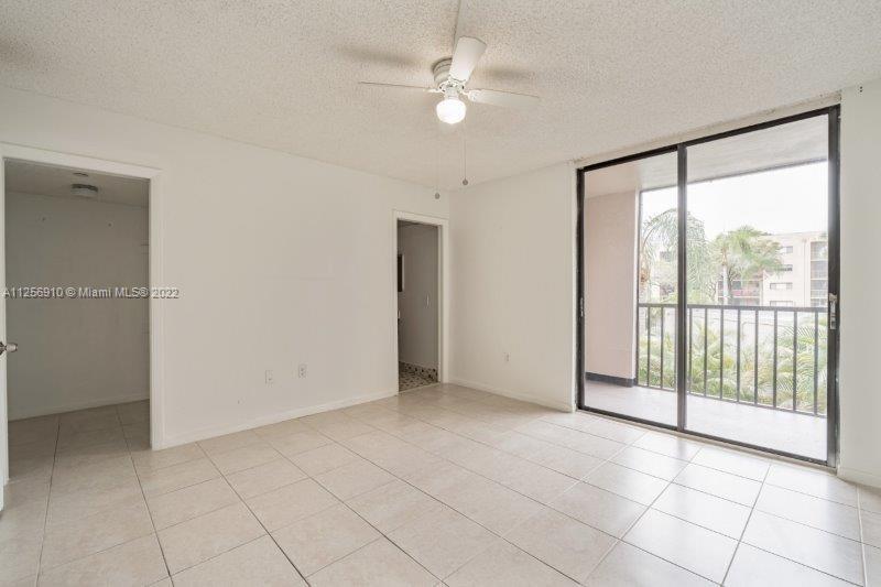 8540 Southwest 133rd Avenue Road, Unit 208 Miami, FL 33183 - Photo 13 of 18 a view of an empty room with a window