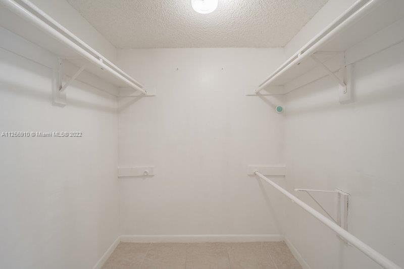 8540 Southwest 133rd Avenue Road, Unit 208 Miami, FL 33183 - Photo 15 of 18 a view of small space with racks on the wall