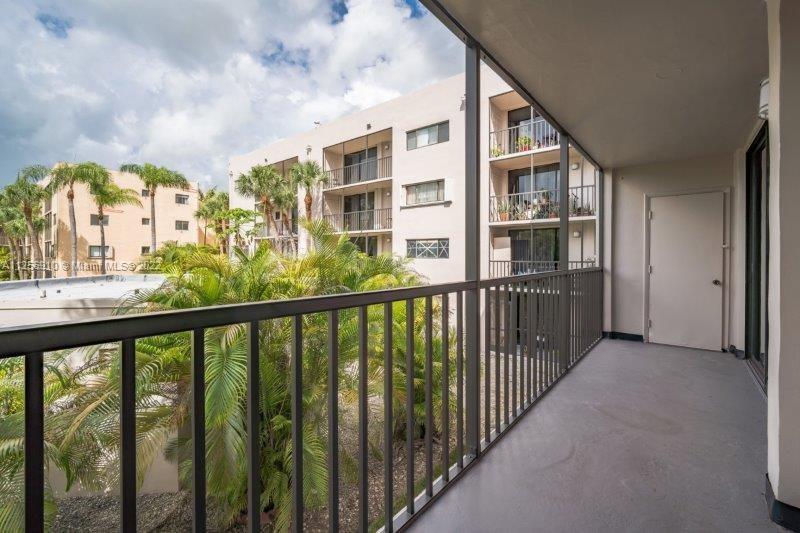 8540 Southwest 133rd Avenue Road, Unit 208 Miami, FL 33183 - Photo 5 of 18 a view of a large building with a balcony