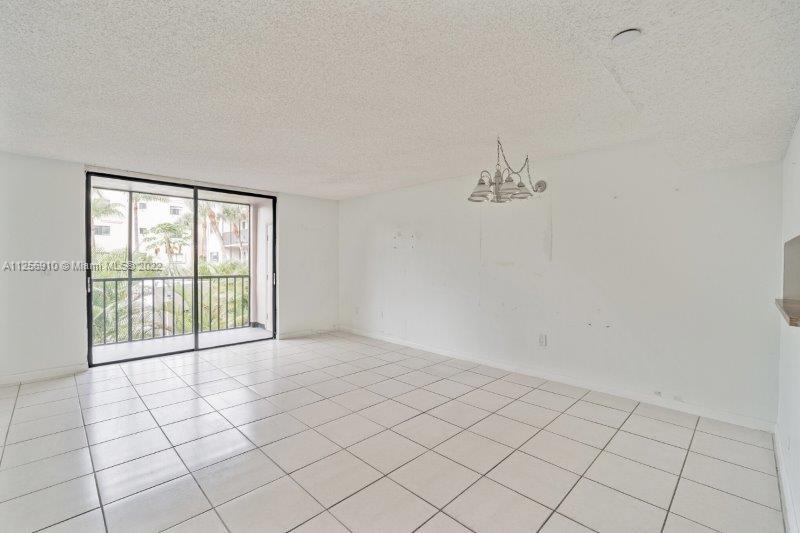 8540 Southwest 133rd Avenue Road, Unit 208 Miami, FL 33183 - Photo 6 of 18 a view of an empty room with a window