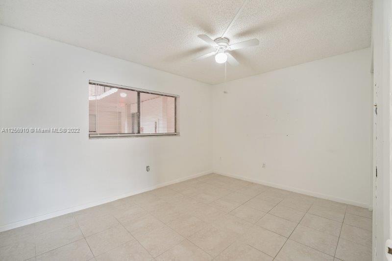 8540 Southwest 133rd Avenue Road, Unit 208 Miami, FL 33183 - Photo 10 of 18 an empty room with a window
