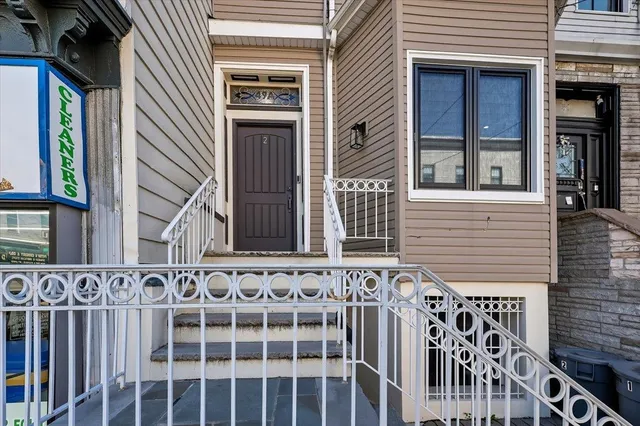 a view of a house with entrance and stairs