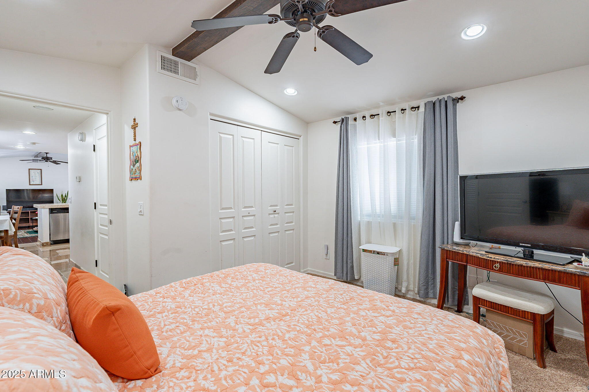 15606 South Gilbert Road, Unit 63 Chandler, AZ 85225 - Photo 15 of 21 a bedroom with a bed and a flat screen tv