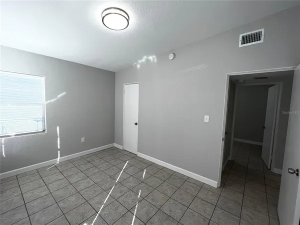 a view of an empty room and window