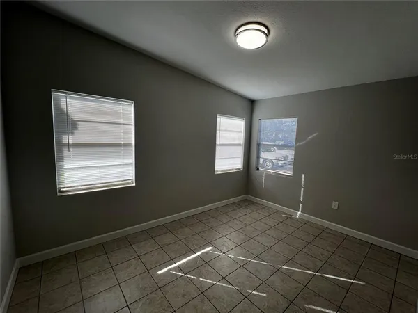 an empty room with windows