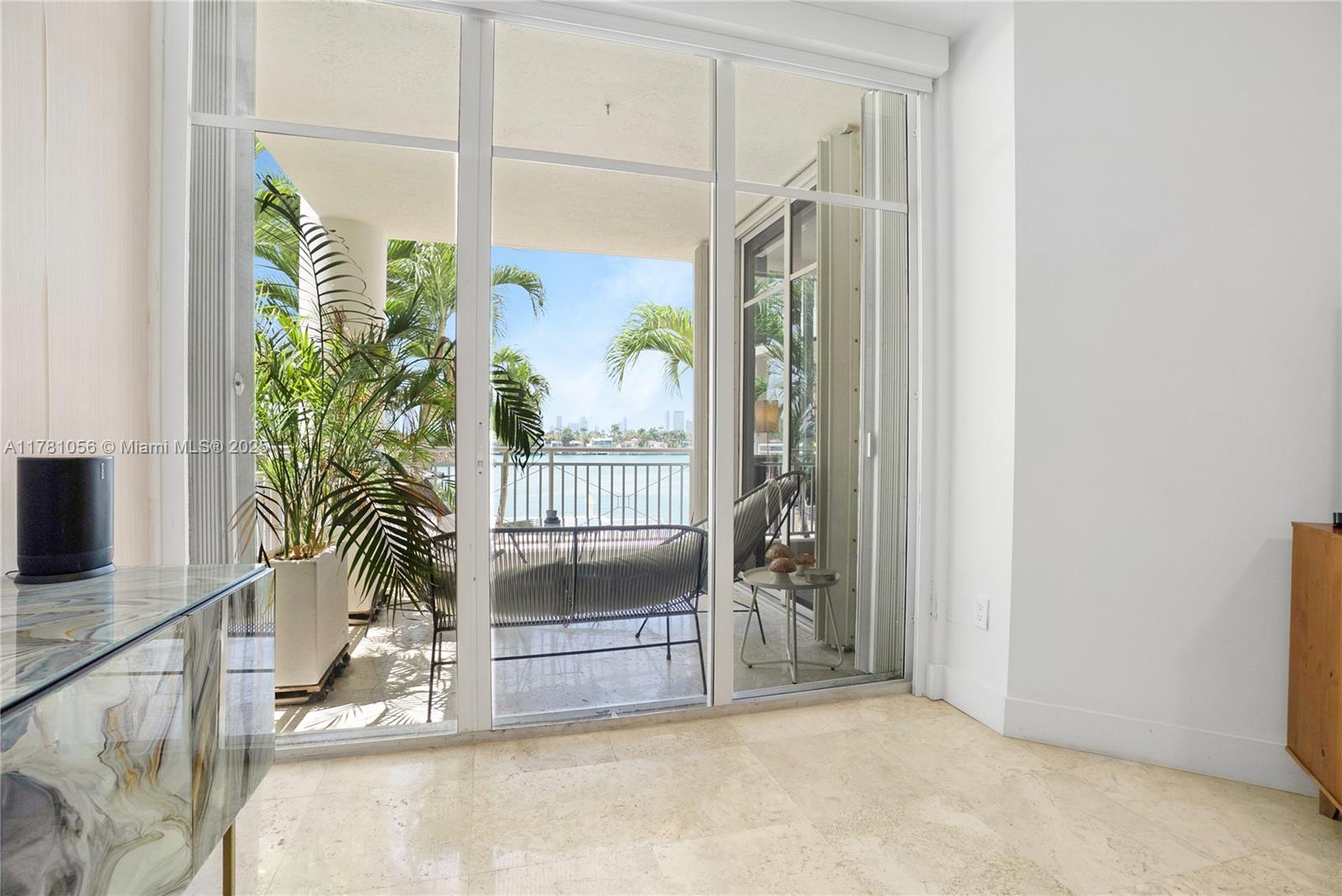 1 Century Lane, Unit 309 Miami Beach, FL 33139 - Photo 12 of 18 a view of a room with a floor to ceiling window and potted plants