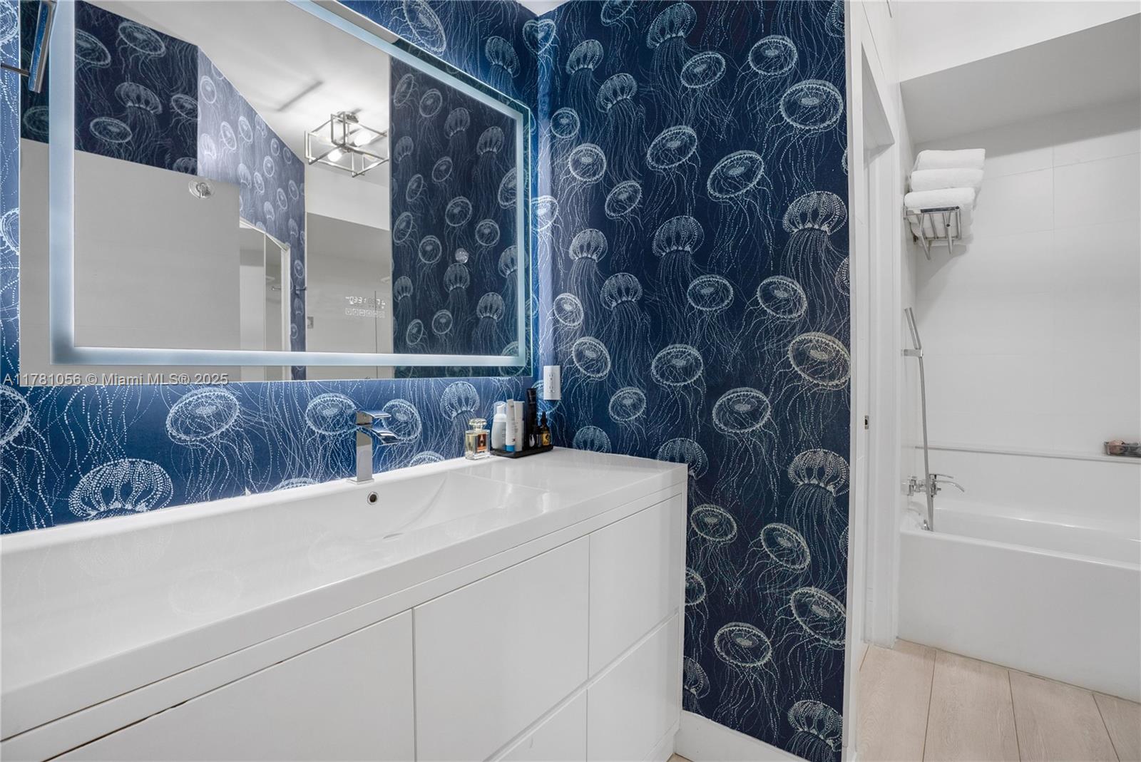 1 Century Lane, Unit 309 Miami Beach, FL 33139 - Photo 13 of 18 a bathroom with a sink and a bathtub