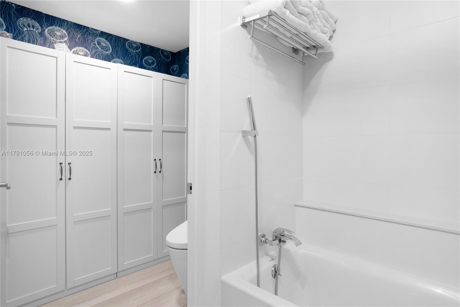 1 Century Lane, Unit 309 Miami Beach, FL 33139 - Photo 15 of 18 a bathroom with a shower and a toilet