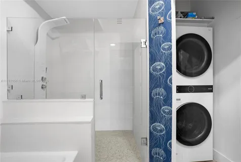 a bathroom with a washer and dryer