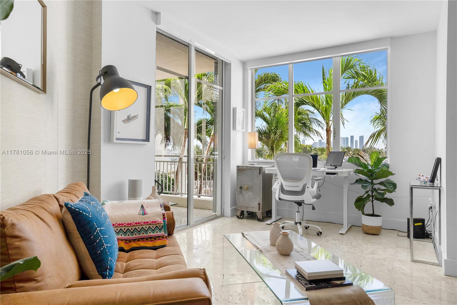 1 Century Lane, Unit 309 Miami Beach, FL 33139 - Photo 3 of 18 a living room with furniture and a large window