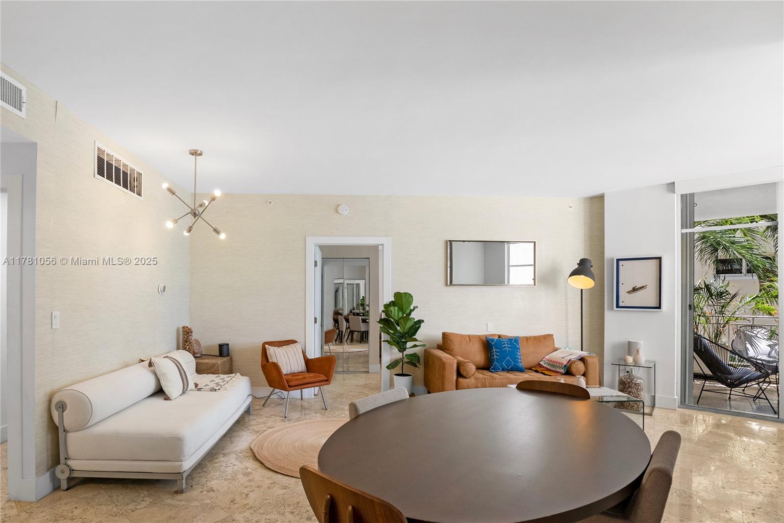 1 Century Lane, Unit 309 Miami Beach, FL 33139 - Photo 4 of 18 a living room with furniture and a wooden floor