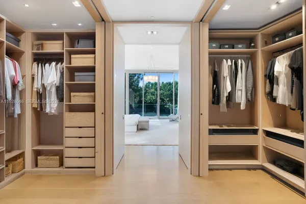 a view of walk in hallway with closet