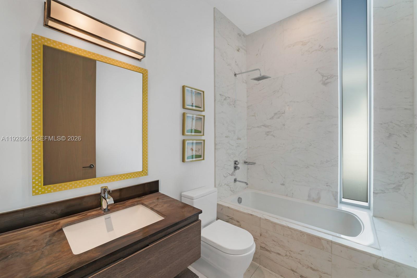 111 Reef Lane Key Biscayne, FL 33149 - Photo 21 of 26 a bathroom with a granite countertop sink toilet and shower