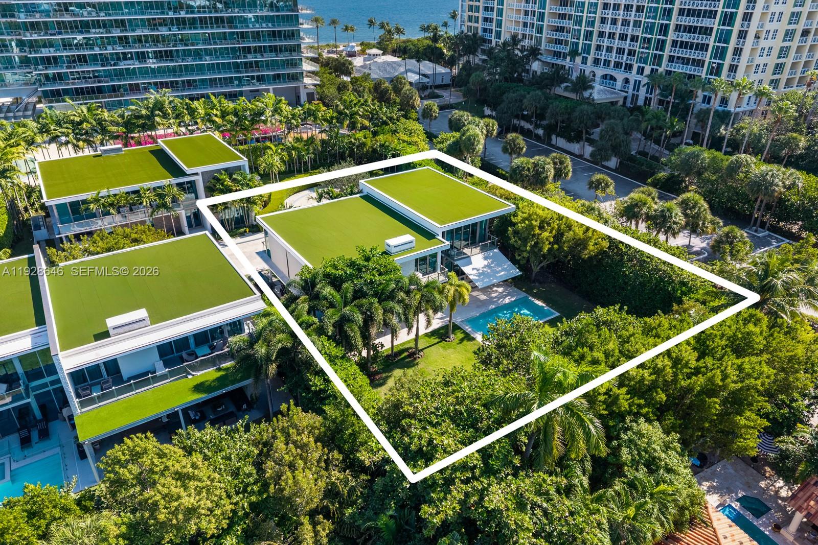 111 Reef Lane Key Biscayne, FL 33149 - Photo 24 of 26 an aerial view of a tennis ground with a table and chairs