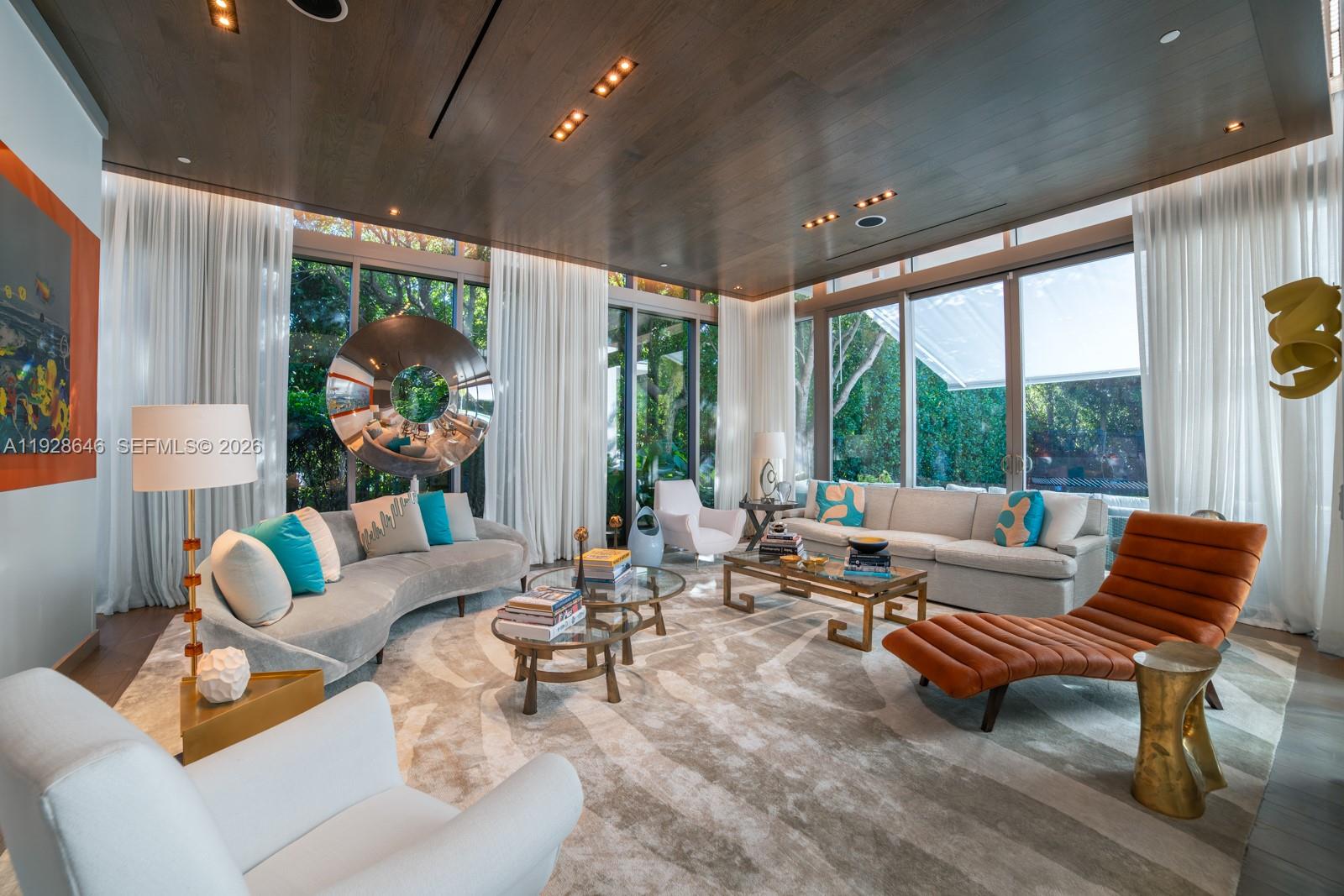 111 Reef Lane Key Biscayne, FL 33149 - Photo 5 of 26 a living room with furniture and a large window