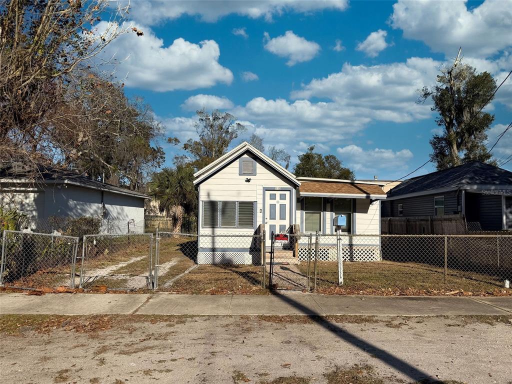 335 Maple Street Daytona Beach, FL 32114 - Photo 13 of 13 a front view of a house with a yard