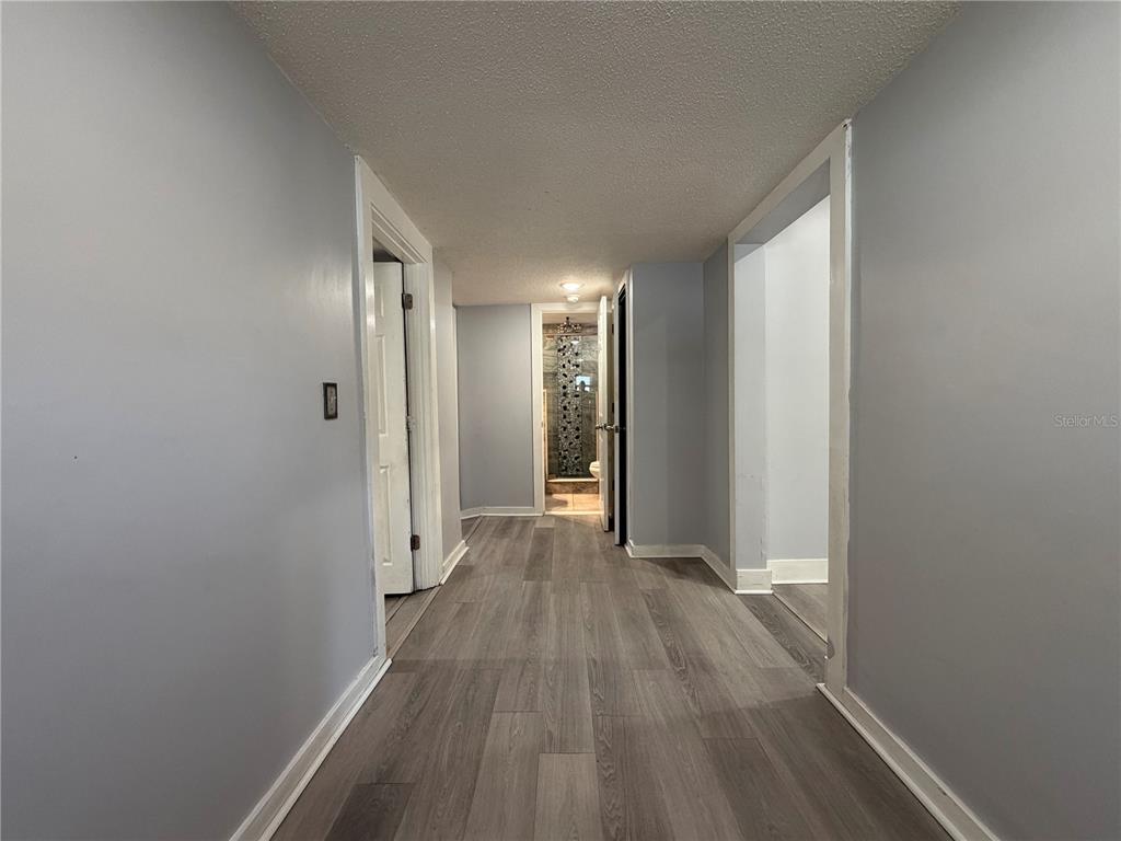 335 Maple Street Daytona Beach, FL 32114 - Photo 6 of 13 a view of hallway with wooden floor