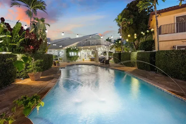 a view of a swimming pool with a patio