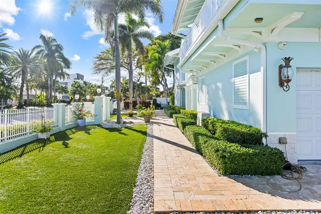 a view of a backyard with swimming pool