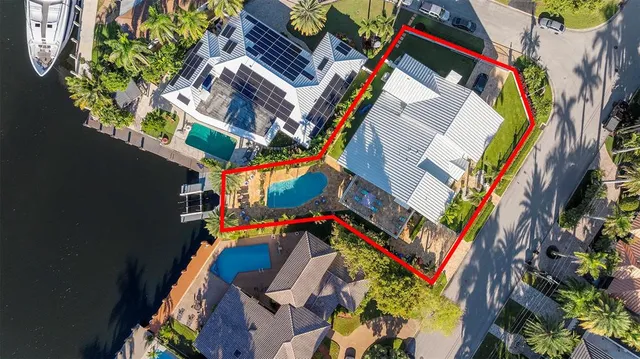 an aerial view of residential house with outdoor space and swimming pool