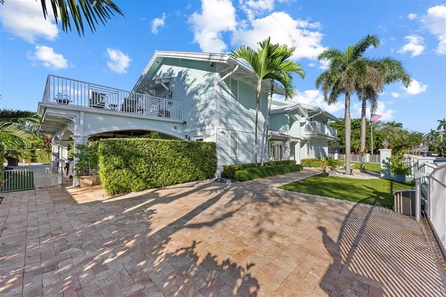 a front view of a house with a yard and a garage