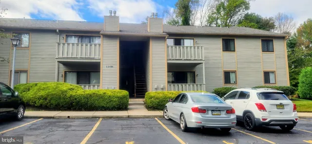 a view of a car park in front of house