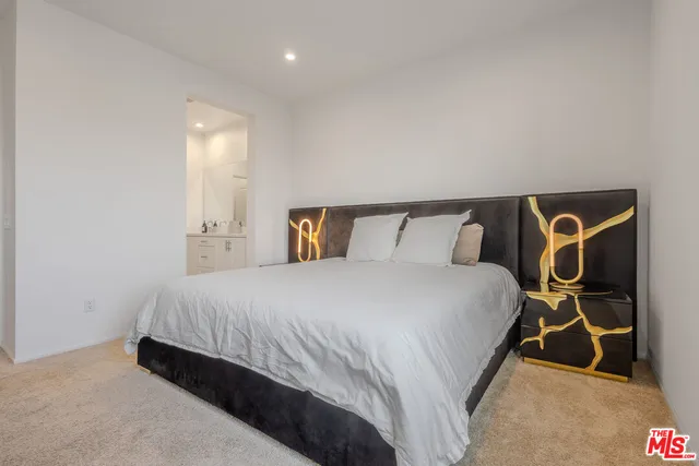 a bedroom with a bed and gym equipment