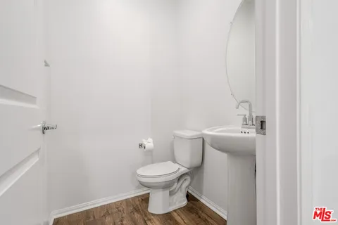 a bathroom with a toilet and a sink