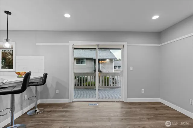 a view of dining room with wooden floor
