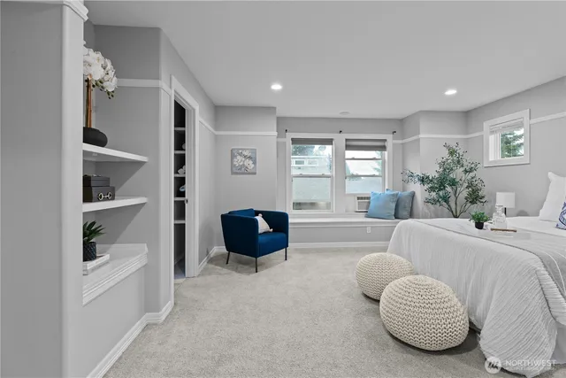a bedroom with a bed and chandelier