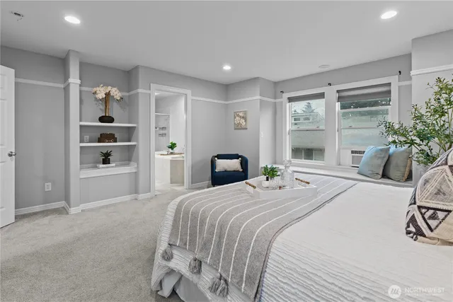 a bathroom with a sink a large mirror and a shower