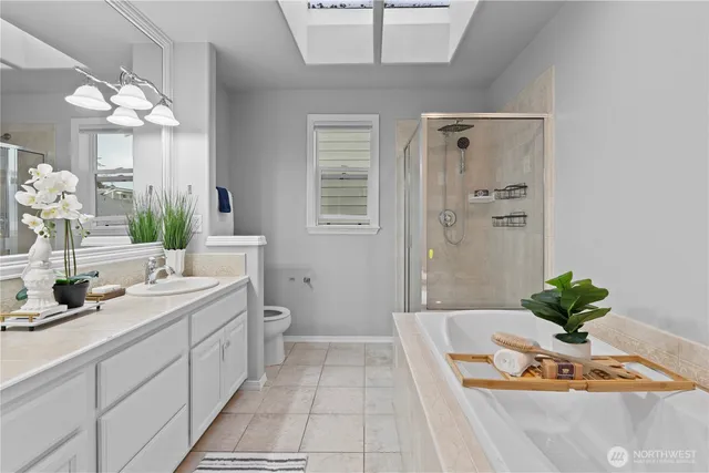 a dining room with furniture and a chandelier