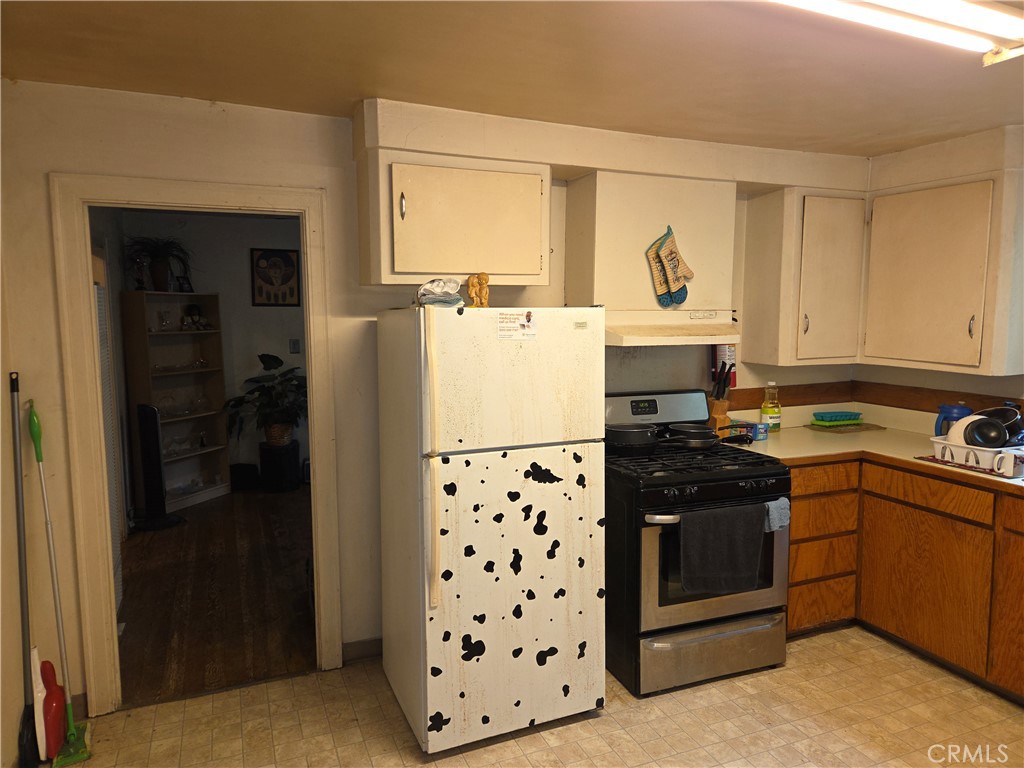 300 Chestnut Avenue Red Bluff, CA 96080 - Photo 13 of 48 a kitchen with appliances cabinets and a sink