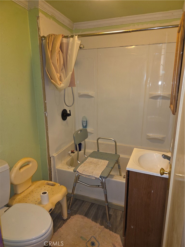 300 Chestnut Avenue Red Bluff, CA 96080 - Photo 15 of 48 a bathroom with a sink mirror vanity and toilet