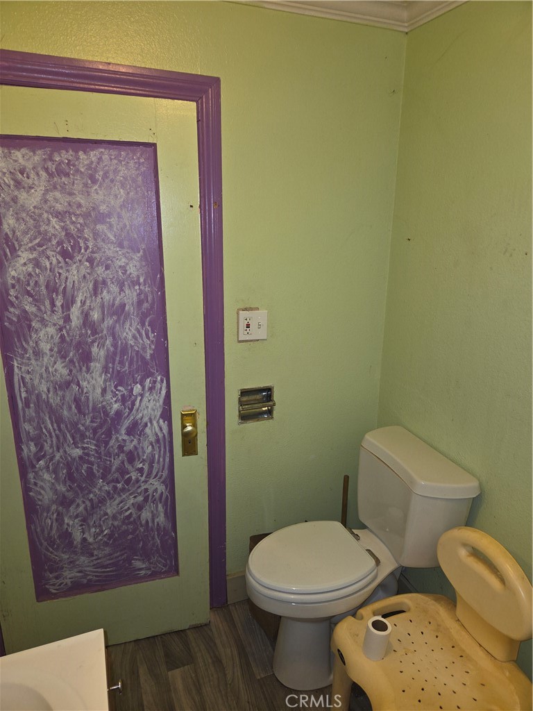 300 Chestnut Avenue Red Bluff, CA 96080 - Photo 16 of 48 a white toilet sitting next to a small bathroom