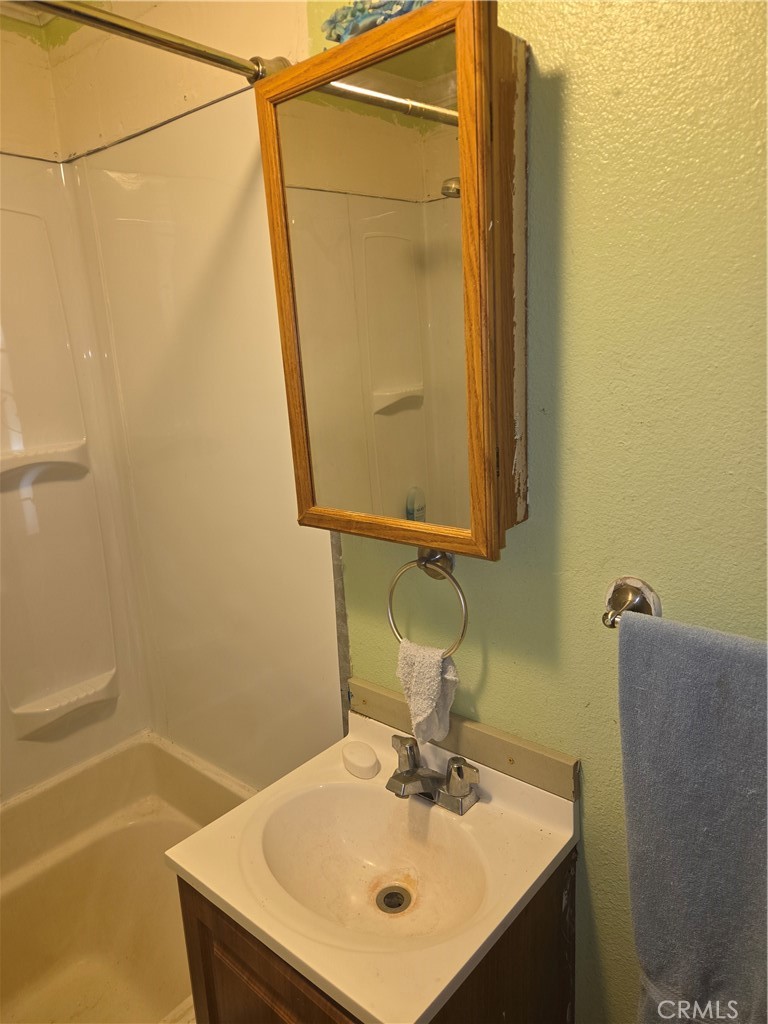 300 Chestnut Avenue Red Bluff, CA 96080 - Photo 17 of 48 a bathroom with a sink and a mirror