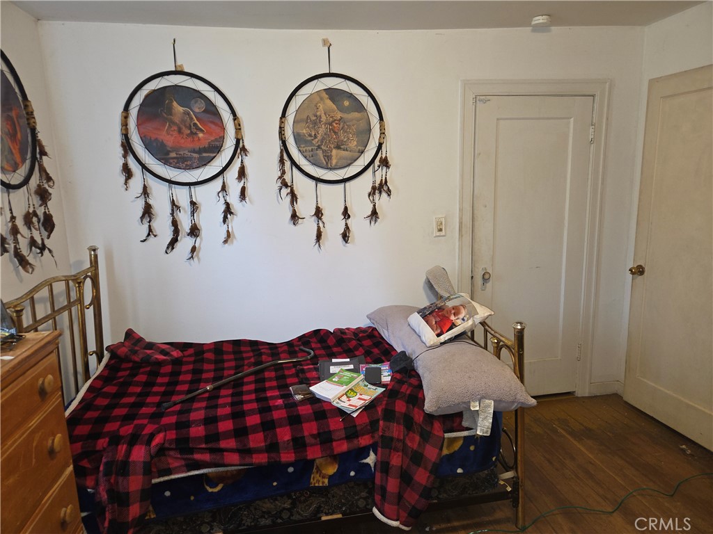 300 Chestnut Avenue Red Bluff, CA 96080 - Photo 22 of 48 a bedroom with furniture and a chair