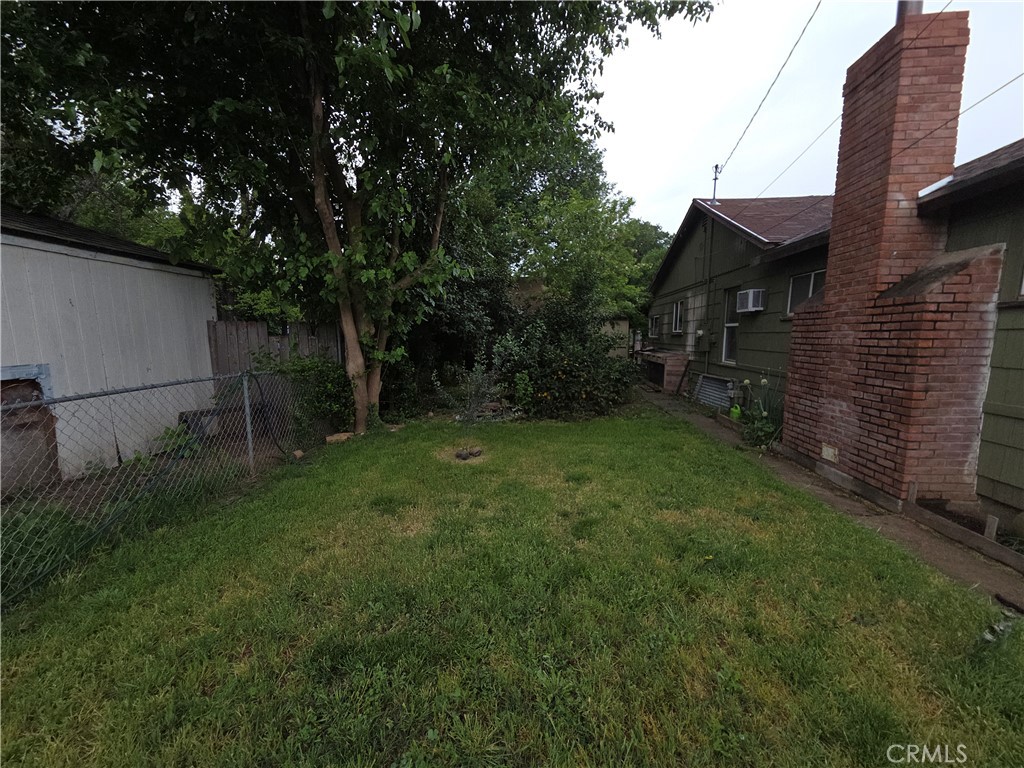 300 Chestnut Avenue Red Bluff, CA 96080 - Photo 29 of 48 a backyard of a house with lots of green space
