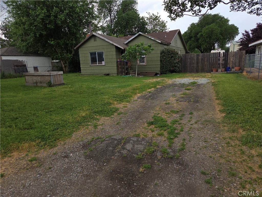 300 Chestnut Avenue Red Bluff, CA 96080 - Photo 46 of 48 a front view of a house with a yard and trees