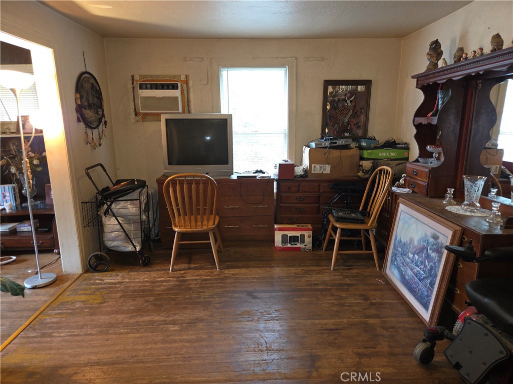 300 Chestnut Avenue Red Bluff, CA 96080 - Photo 5 of 48 a living room with furniture a flat screen tv and a window