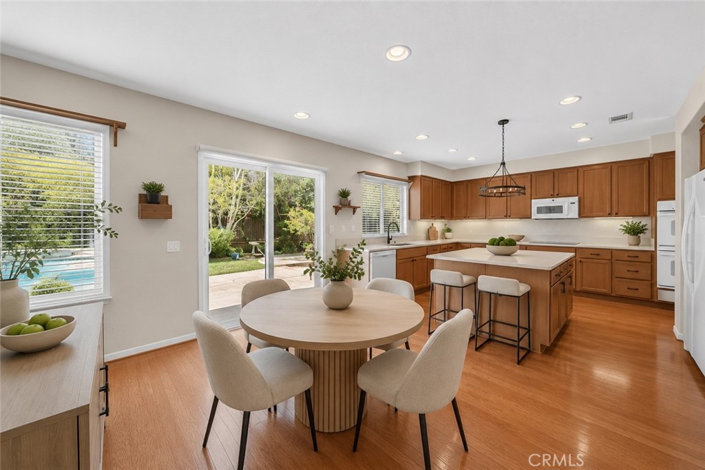22262 Trinity Place Saugus, CA 91390 - Photo 29 of 87 AI Enhanced 8 / Kitchen Table into Kitchen
