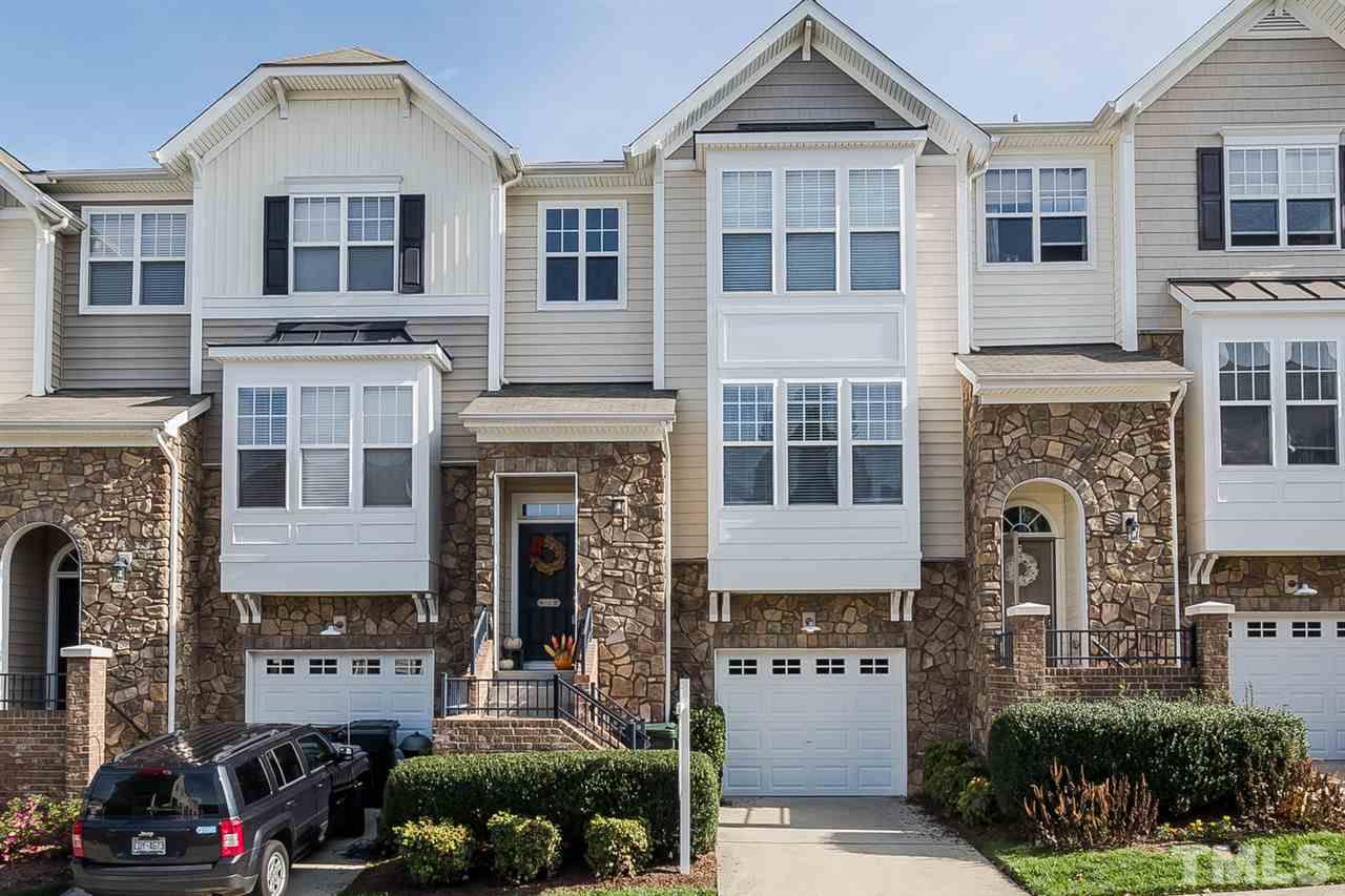 5708 Cameo Glass Way Raleigh, NC 27612 - Photo 1 of 23 a front view of a house with a garden