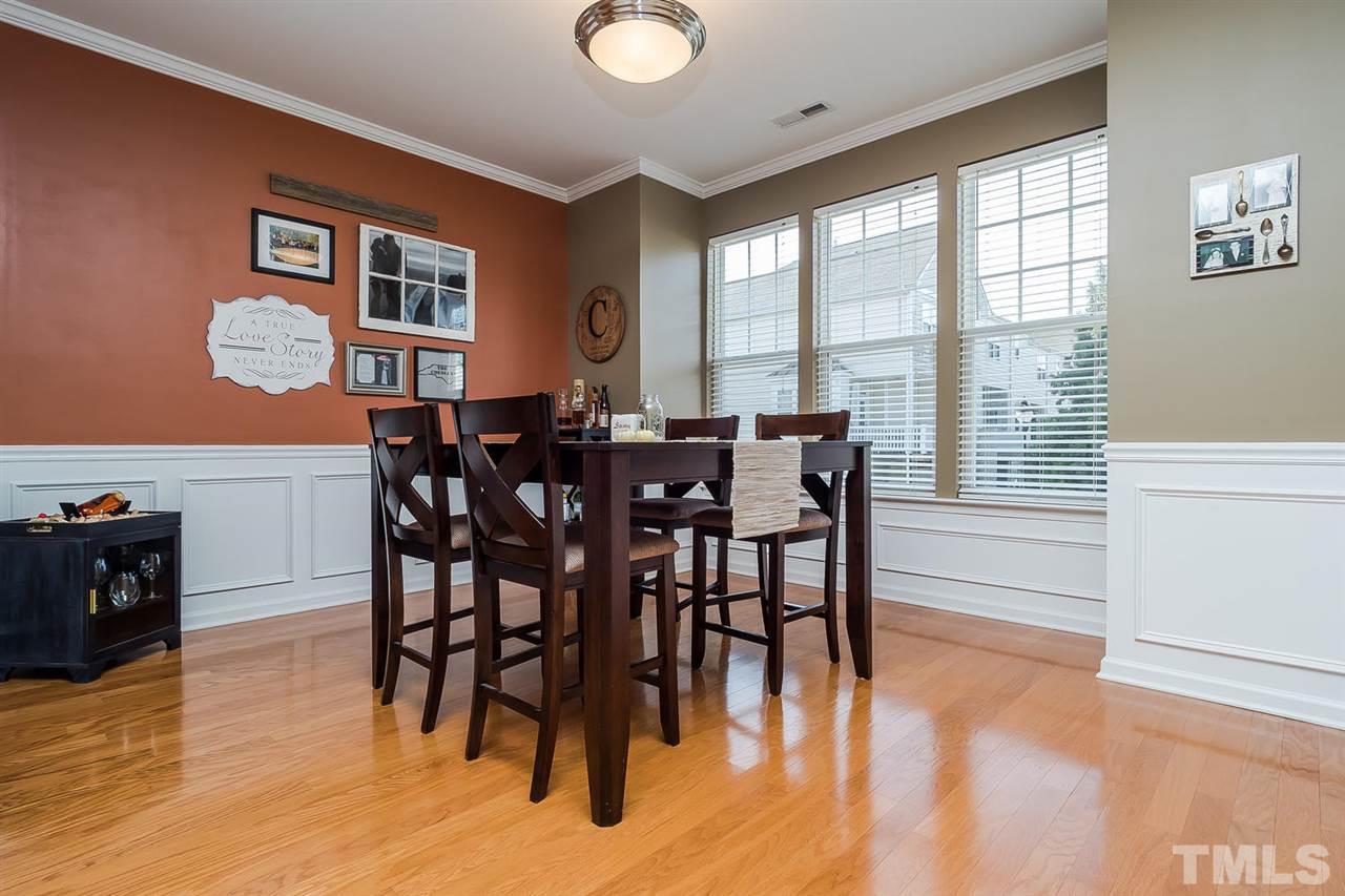 5708 Cameo Glass Way Raleigh, NC 27612 - Photo 2 of 23 a view of a dining room with furniture window and wooden floor