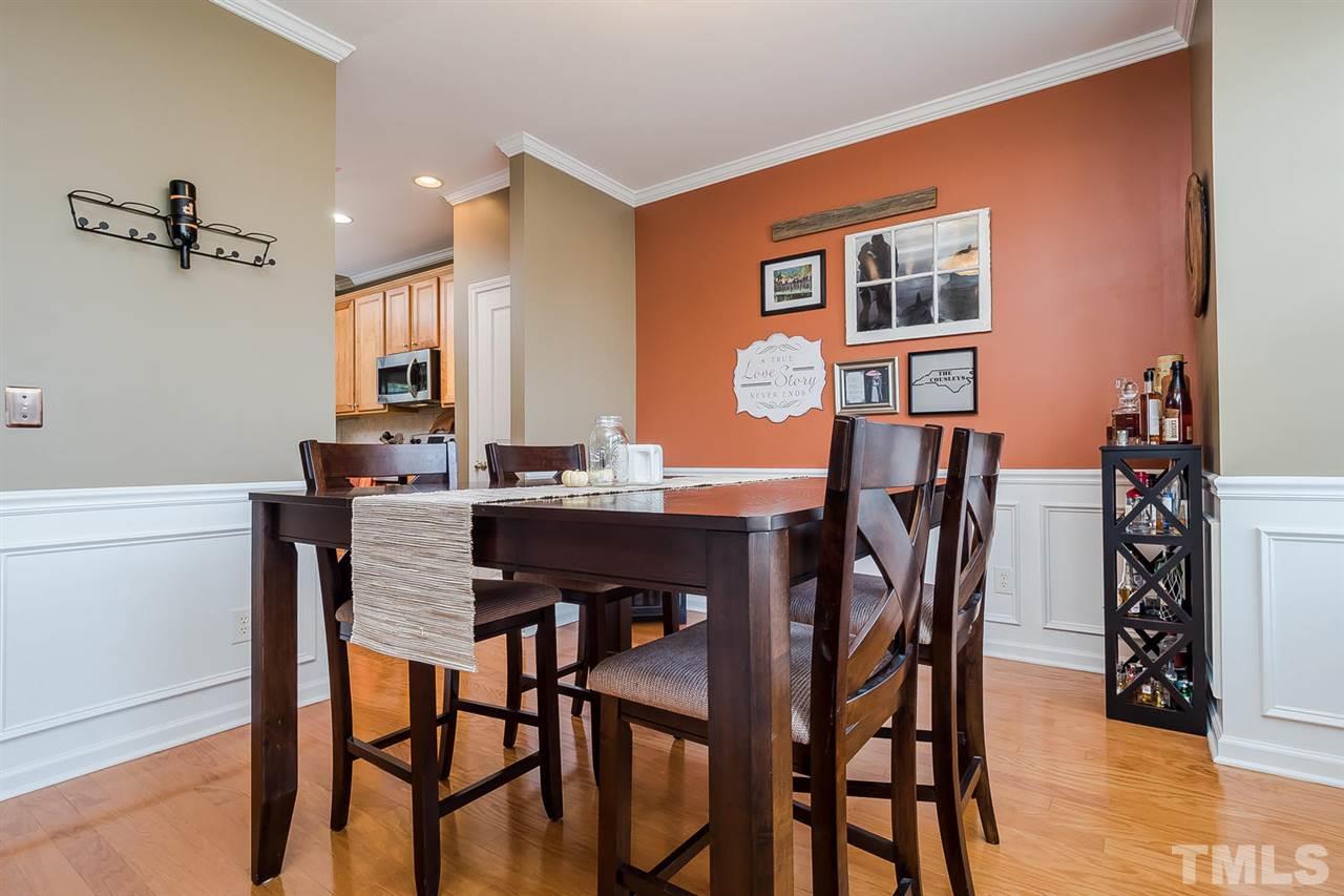 5708 Cameo Glass Way Raleigh, NC 27612 - Photo 3 of 23 a view of a dining room with furniture and wooden floor