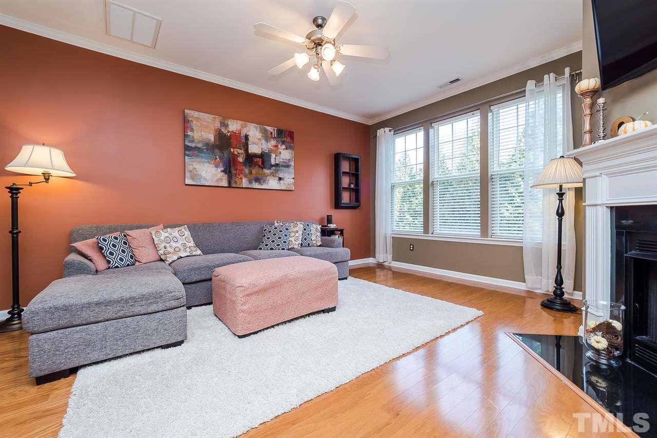 5708 Cameo Glass Way Raleigh, NC 27612 - Photo 8 of 23 a living room with fireplace furniture and a flat screen tv