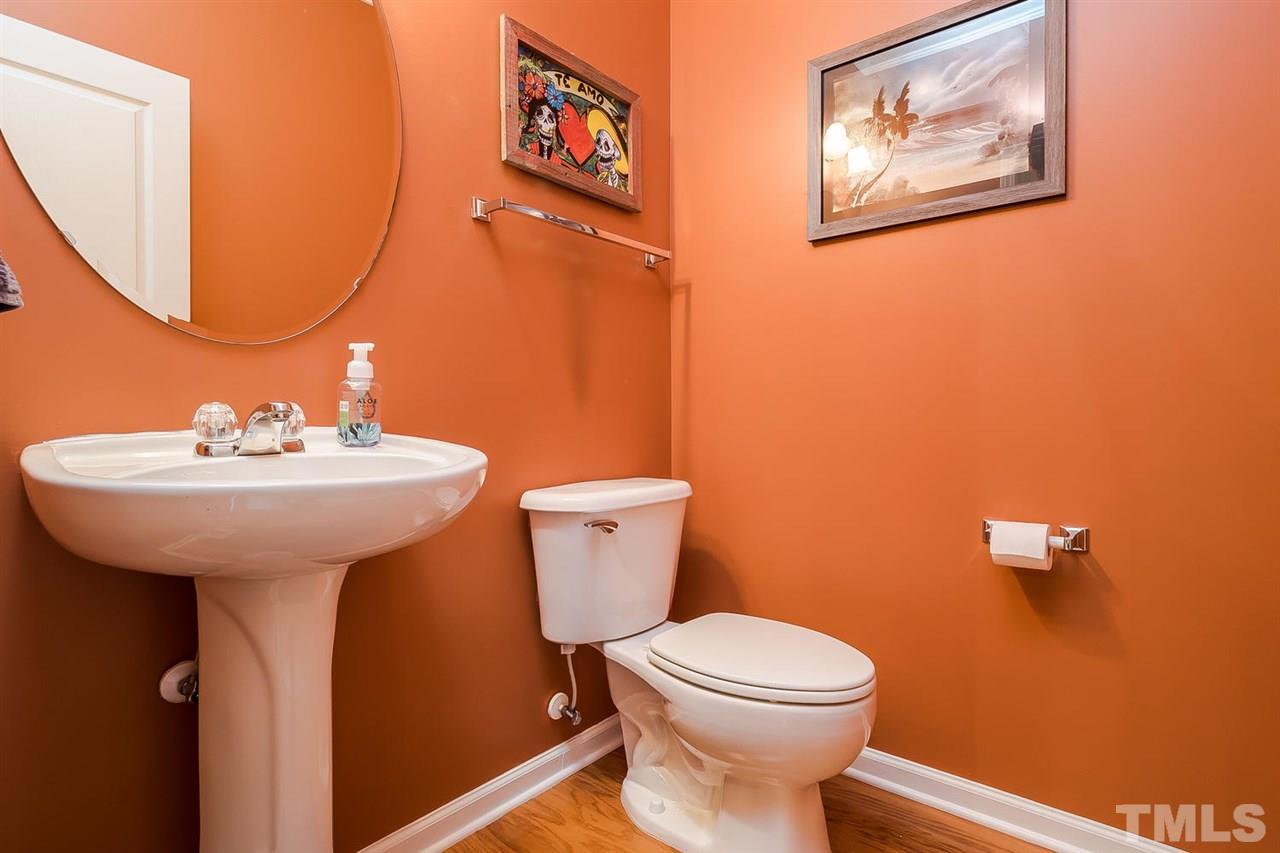 5708 Cameo Glass Way Raleigh, NC 27612 - Photo 10 of 23 a bathroom with a sink mirror and toilet