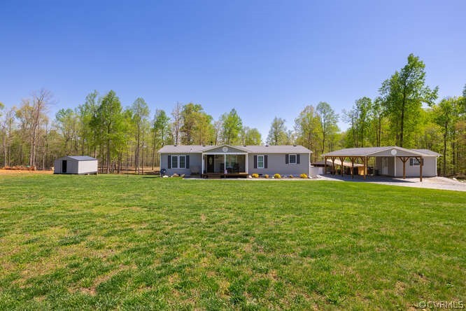 1680 Battes Road Green Bay, VA 23942 - Photo 2 of 38 a front view of a house with garden