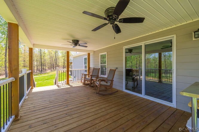 1680 Battes Road Green Bay, VA 23942 - Photo 21 of 38 a view of a patio with table and chairs floor to ceiling window with wooden floor