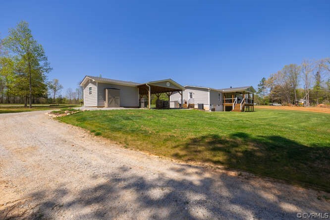 1680 Battes Road Green Bay, VA 23942 - Photo 27 of 38 a view of a house with a big yard and large trees