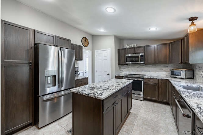 1680 Battes Road Green Bay, VA 23942 - Photo 5 of 38 a kitchen with stainless steel appliances granite countertop a refrigerator a stove a sink and a microwave